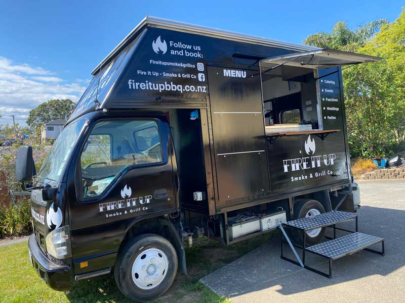 Fire It Up Smoke & Grill Co black BBQ food truck opened up